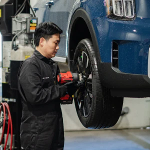 Technician installing tire