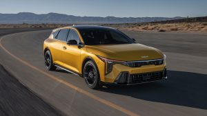 2026 Kia K4 Hatchback on road surrounded by dirt