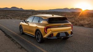 Exterior shot of 2026 Kia K4 Hatchback on the road as sun is setting