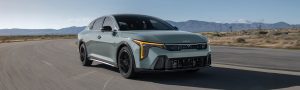 2026 Kia K4 Sedan driving down road