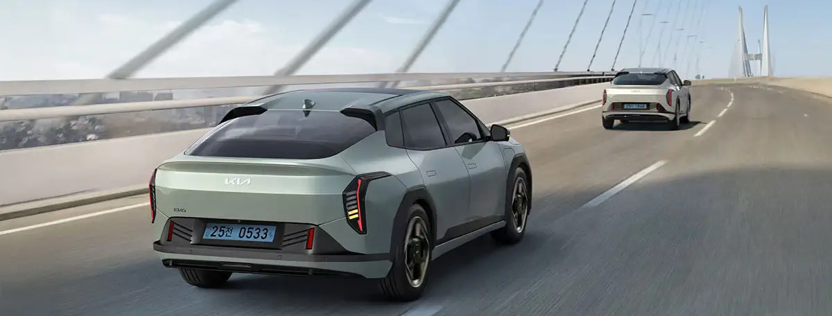 2026 Kia EV4 driving across bridge